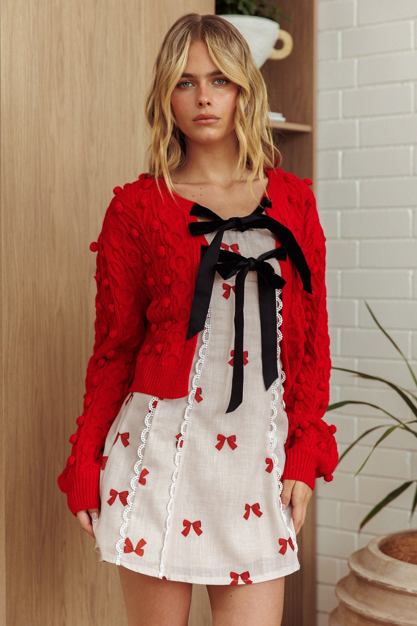 Cardigan con fiocco in velluto Tera rosso