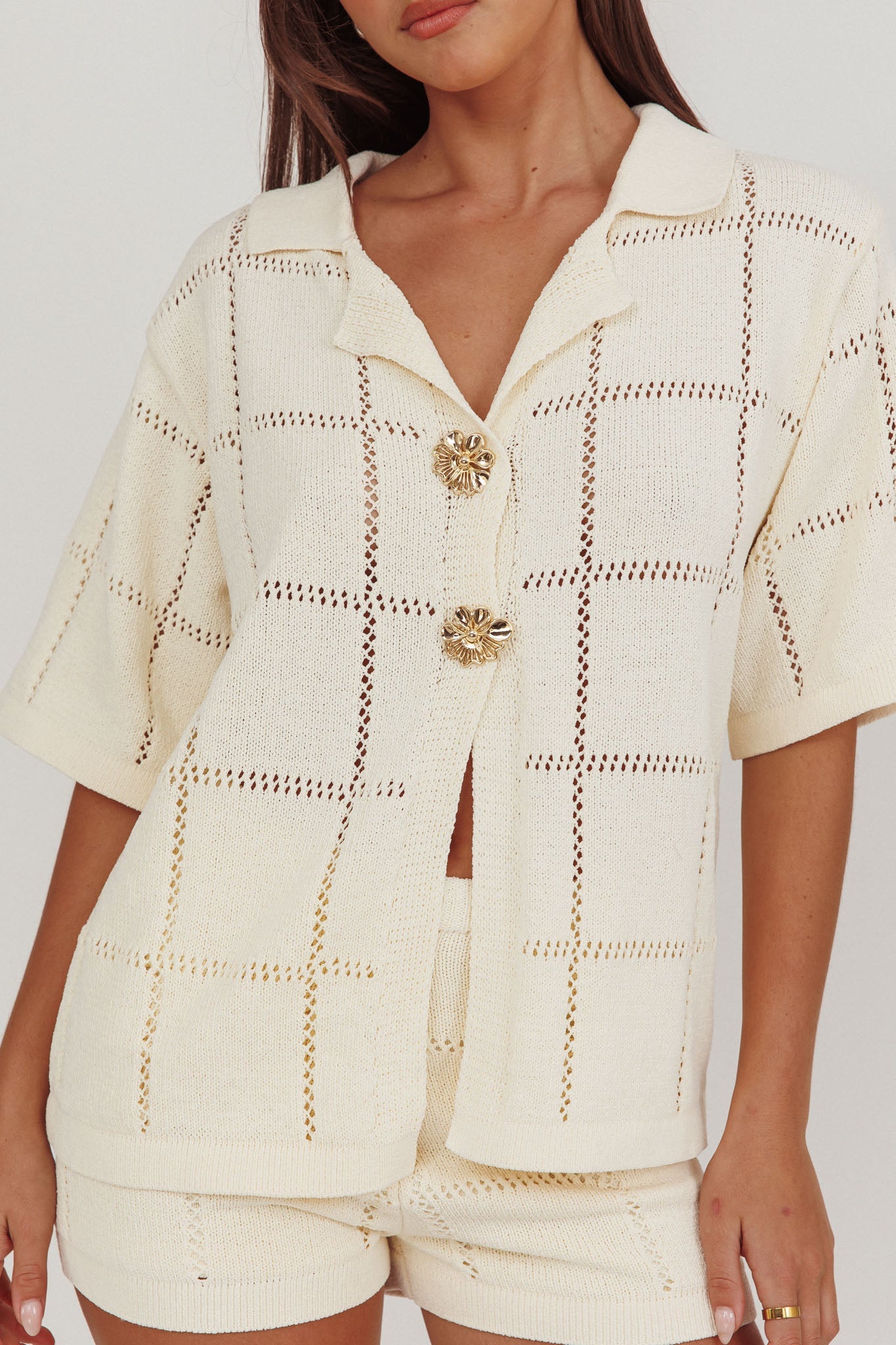 Top con bottoni dorati in maglia da marinaio color crema