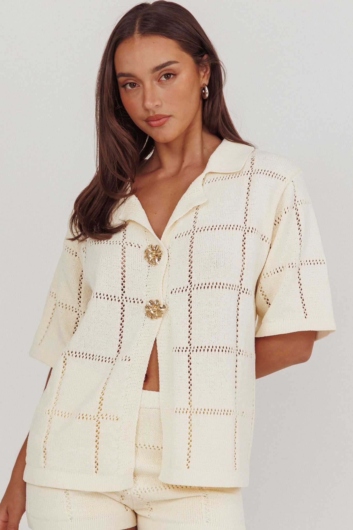 Top con bottoni dorati in maglia da marinaio color crema