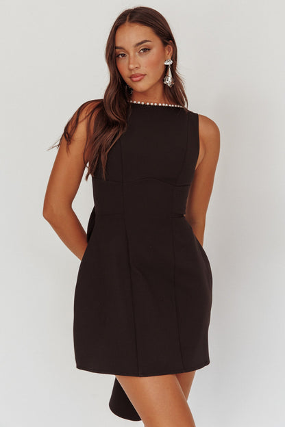 Mini abito oversize con fiocco e finiture in perle opulente nero