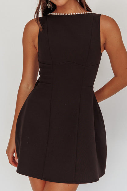 Mini abito oversize con fiocco e finiture in perle opulente nero