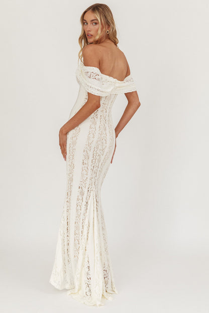 Abito lungo Enigma con spalle scoperte in pizzo color crema