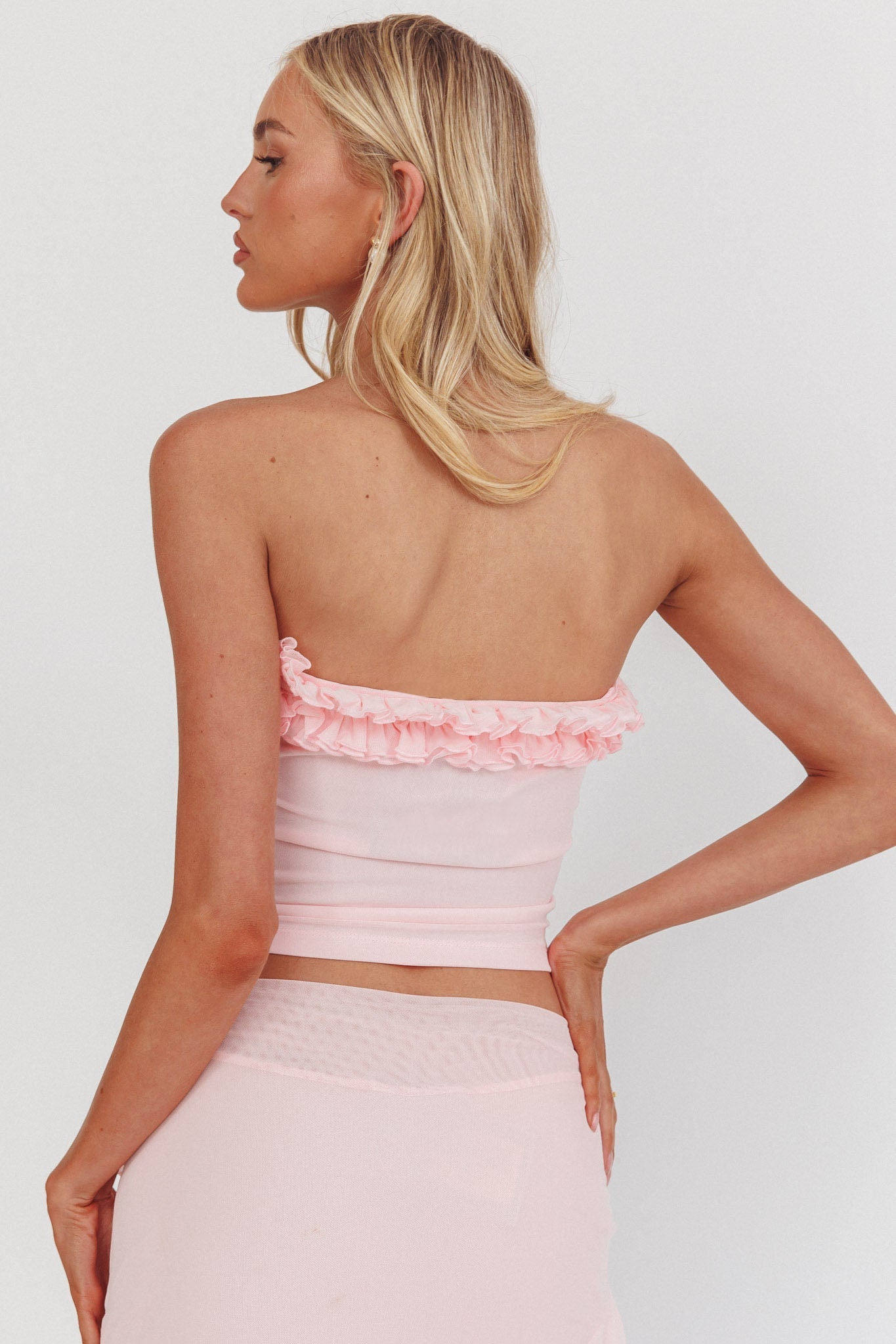Top senza spalline con volant color zucchero glassato rosa