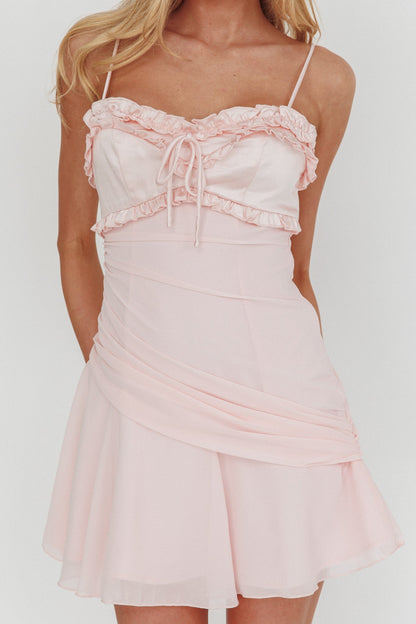 Mini abito rosa con balze delicate