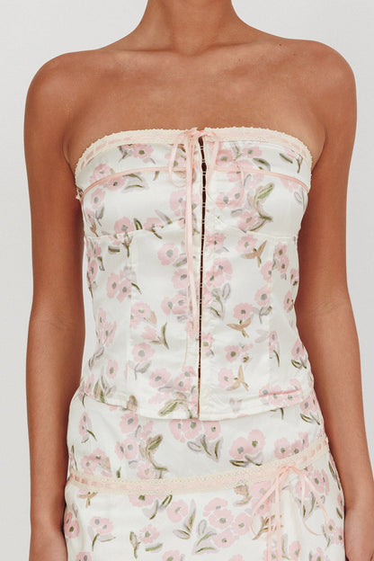 Top senza spalline Tiya con fiocco floreale rosa