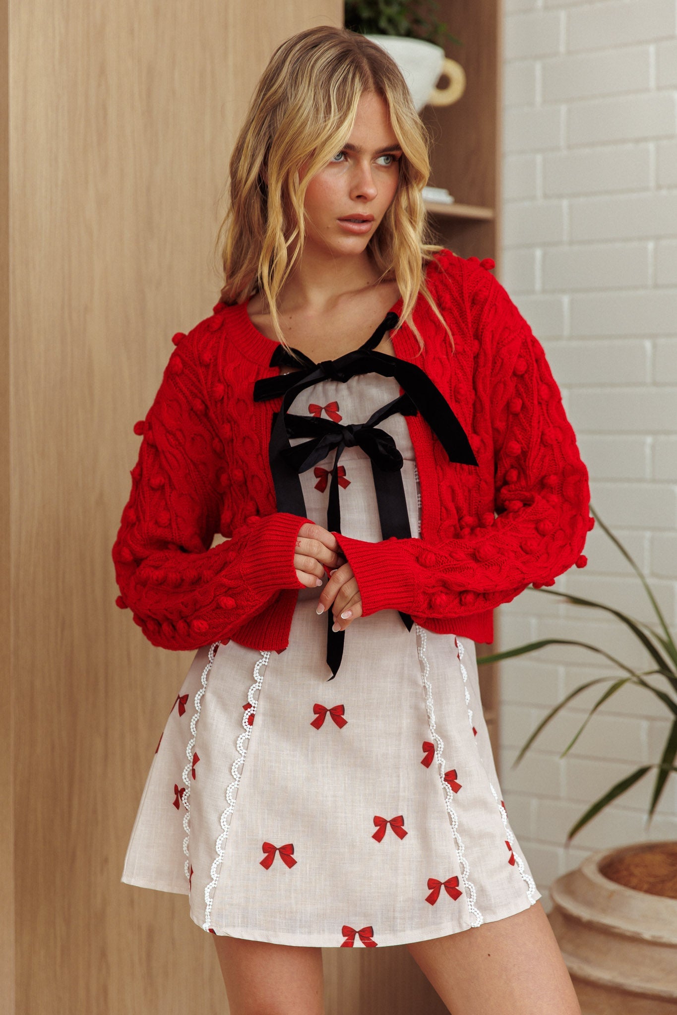 Cardigan con fiocco in velluto Tera rosso