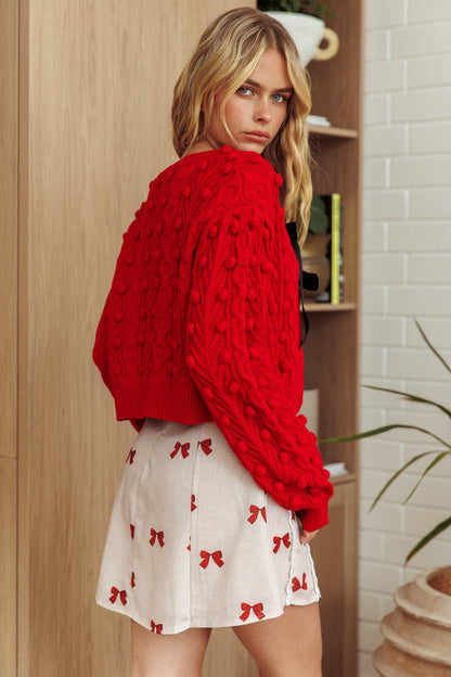 Cardigan con fiocco in velluto Tera rosso