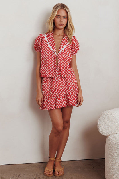 Top Danessa con nodo frontale e motivo floreale rosso