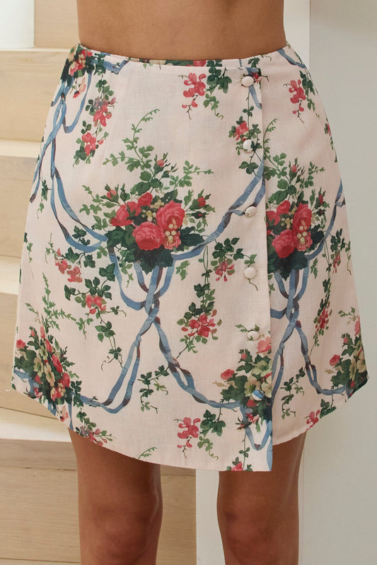 Minigonna avvolgente fissa su misura rosa floreale
