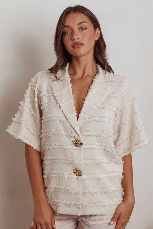 Top con colletto e rifiniture a bordo grezzo Reed, color crema