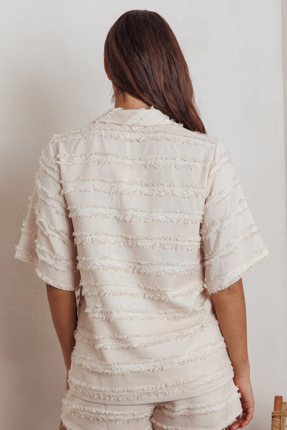 Top con colletto e rifiniture a bordo grezzo Reed, color crema